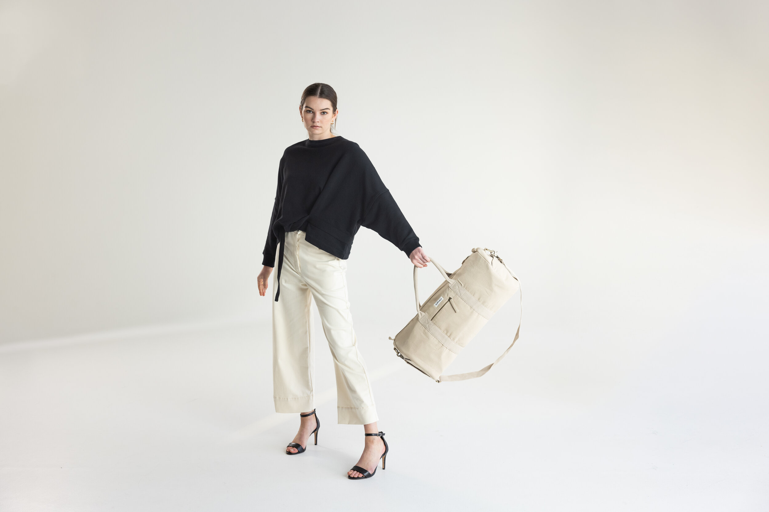 Duffle_Co Weekender Duffle in beige swing.jpg