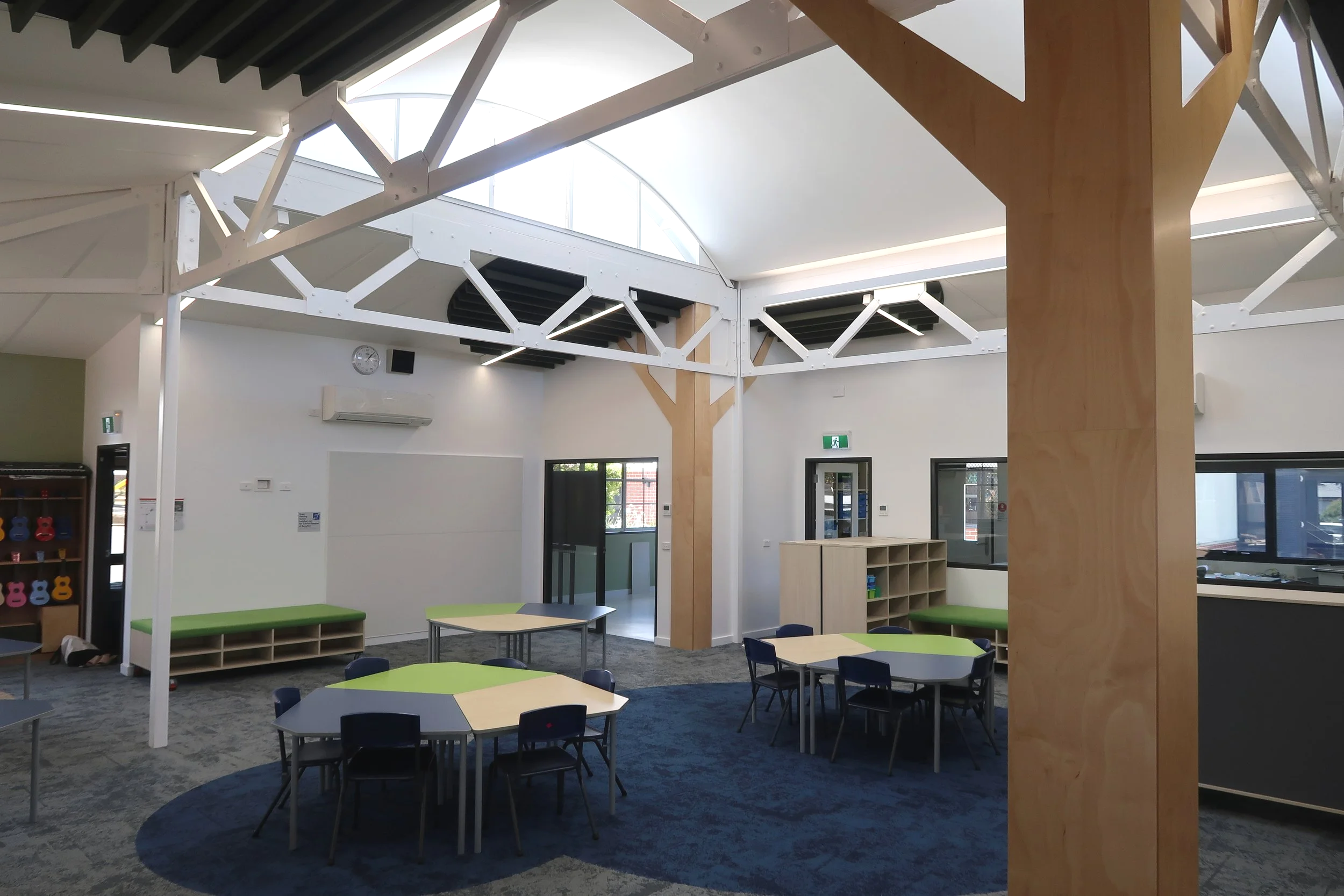 Refurbished Bittern Primary School classroom with exposed timber structure, flexible learning areas and natural light.