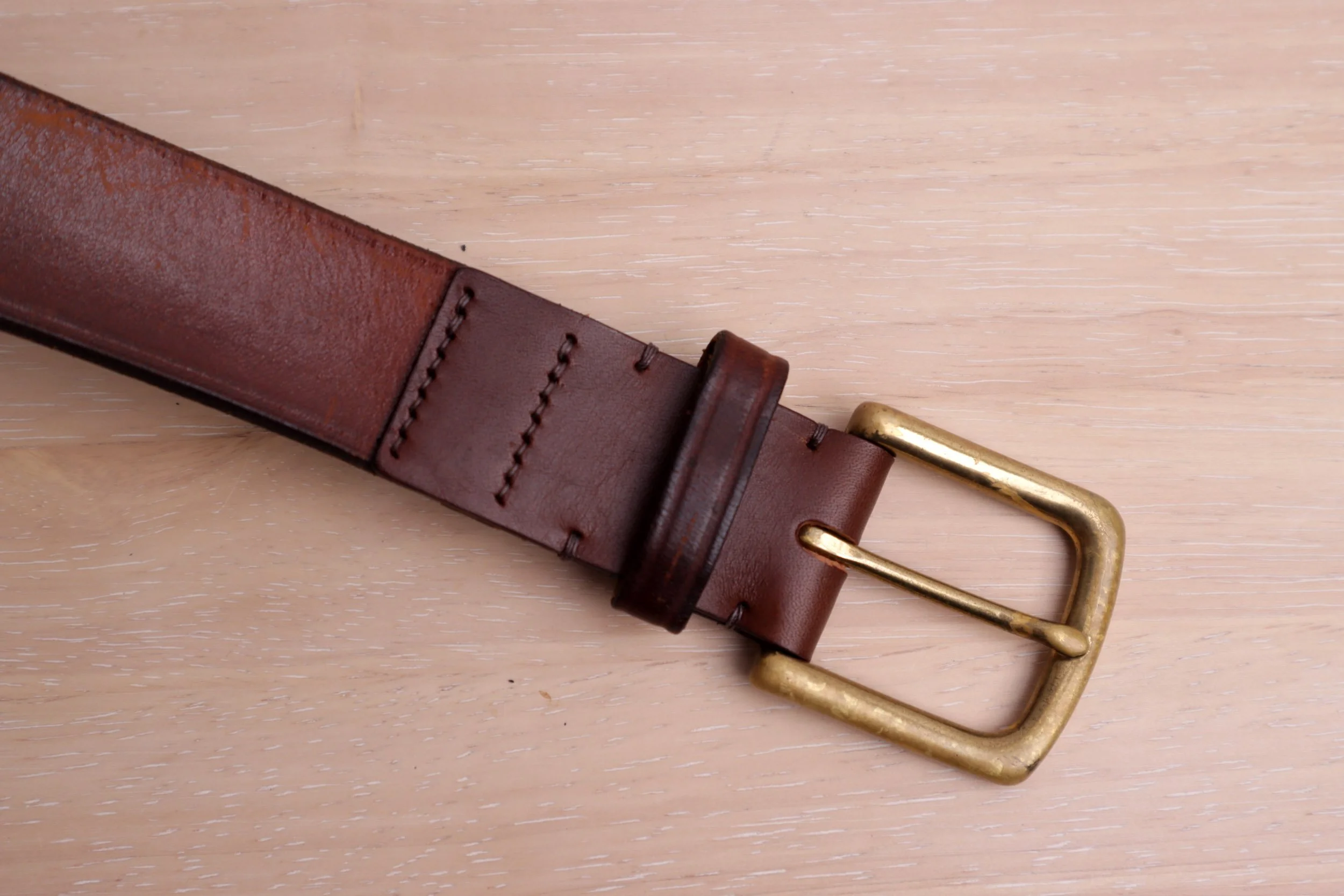 Replaced the leather around the buckle on this brown belt