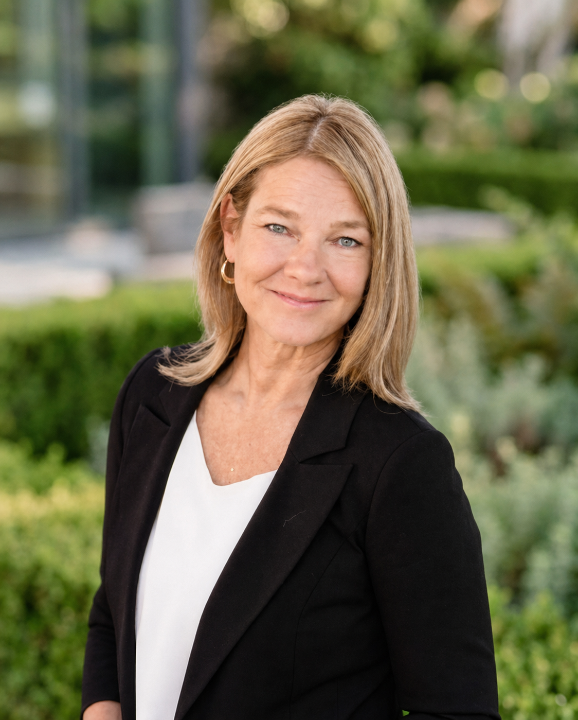 Natalie Stevens, Senior Accountant and Assistant Controller at Oracle Profitability, professional headshot outdoors in Gilbert Arizona.