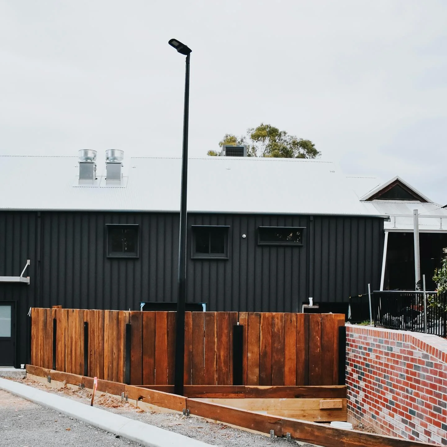 Like most things with this project - the service bay fence was no small job. It look a little army to bring it together.

The jarrah boards once lined our old car park. We&rsquo;ve now given them a second life.

Sam stripped them back, Justine &amp; 