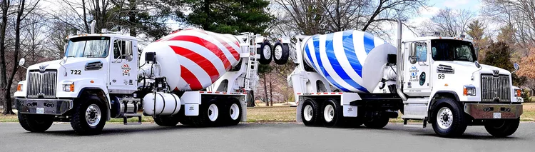Modern red- and blue-striped Kienstra ready-mix trucks