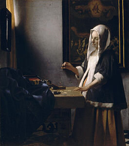 265px-woman_holding_a_balance_vermeer.jpg