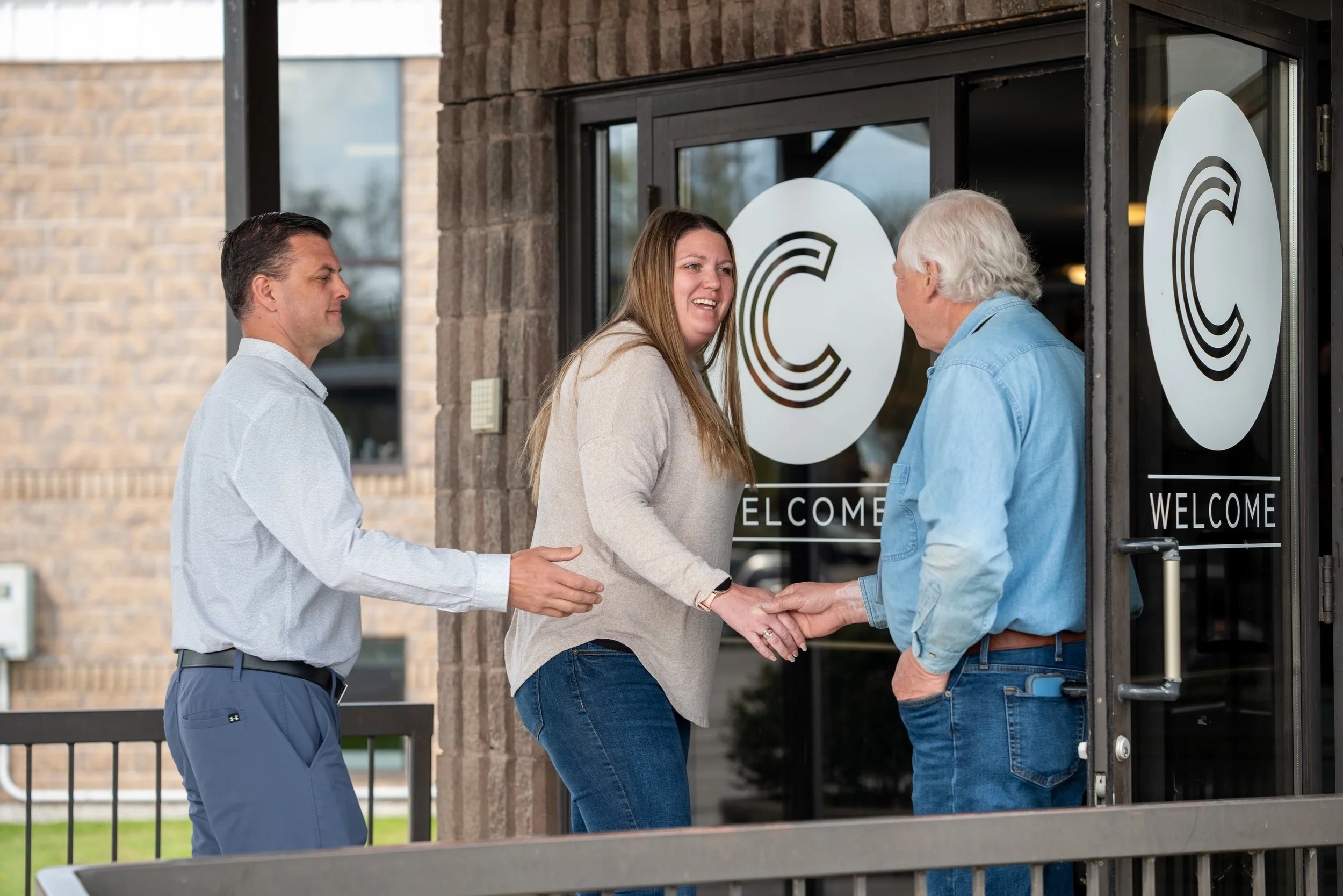 Greeter meeting someone at the door.