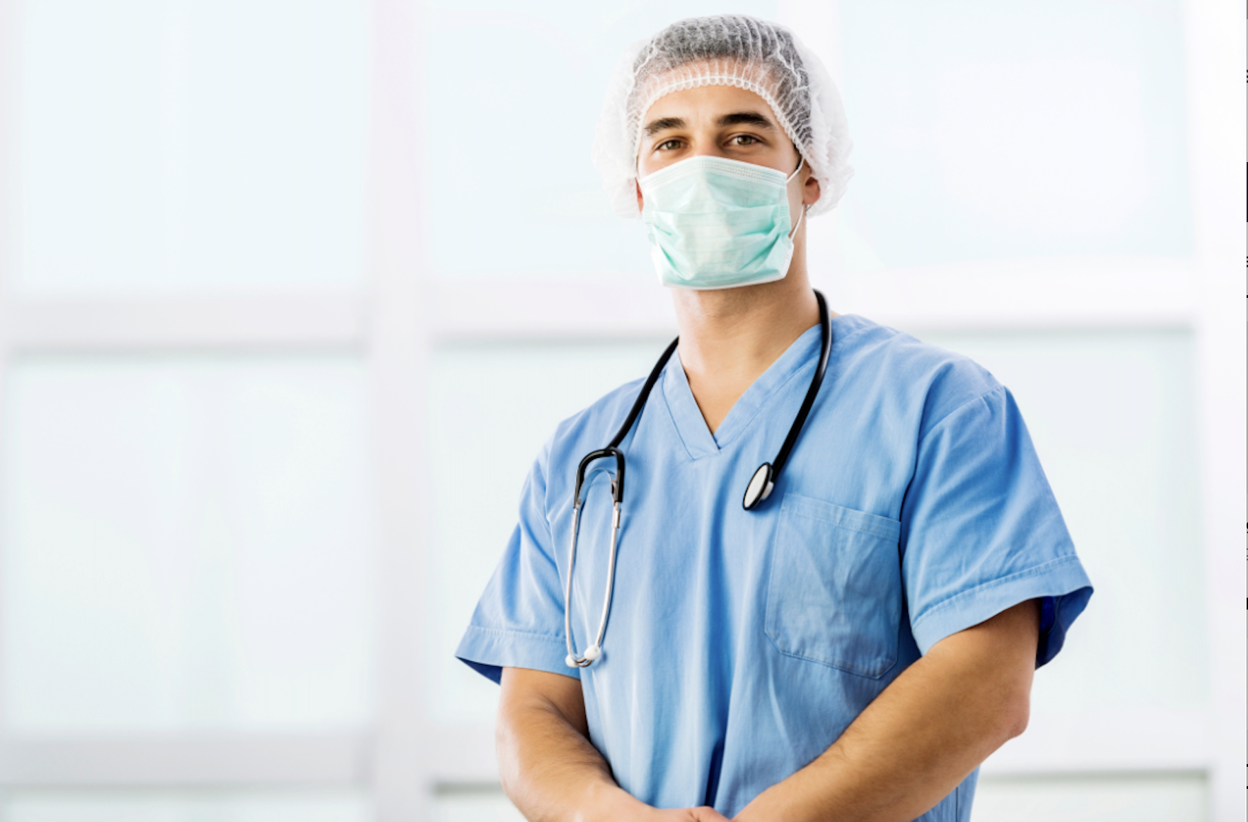 Surgeon using T-Stat tissue oximetry to continuously monitor tissue oxygenation during breast reconstruction.