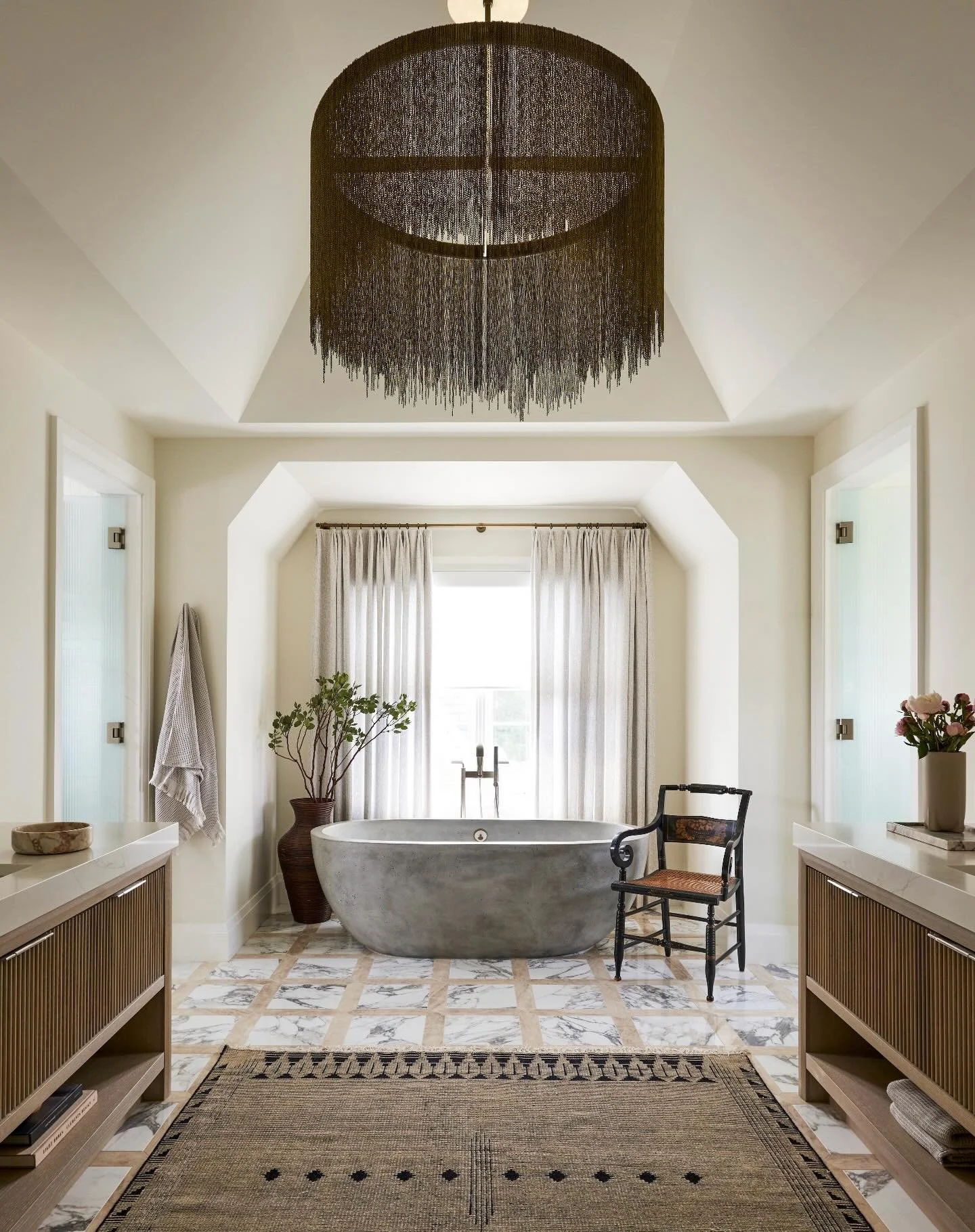 A primary suite doesn&rsquo;t need to be overly complicated&mdash;it just needs the right balance.

A concrete tub against a custom marble tile mosaic. A bright, clean shower that keeps the space feeling fresh.
 Rich color in the bedroom with warmer 