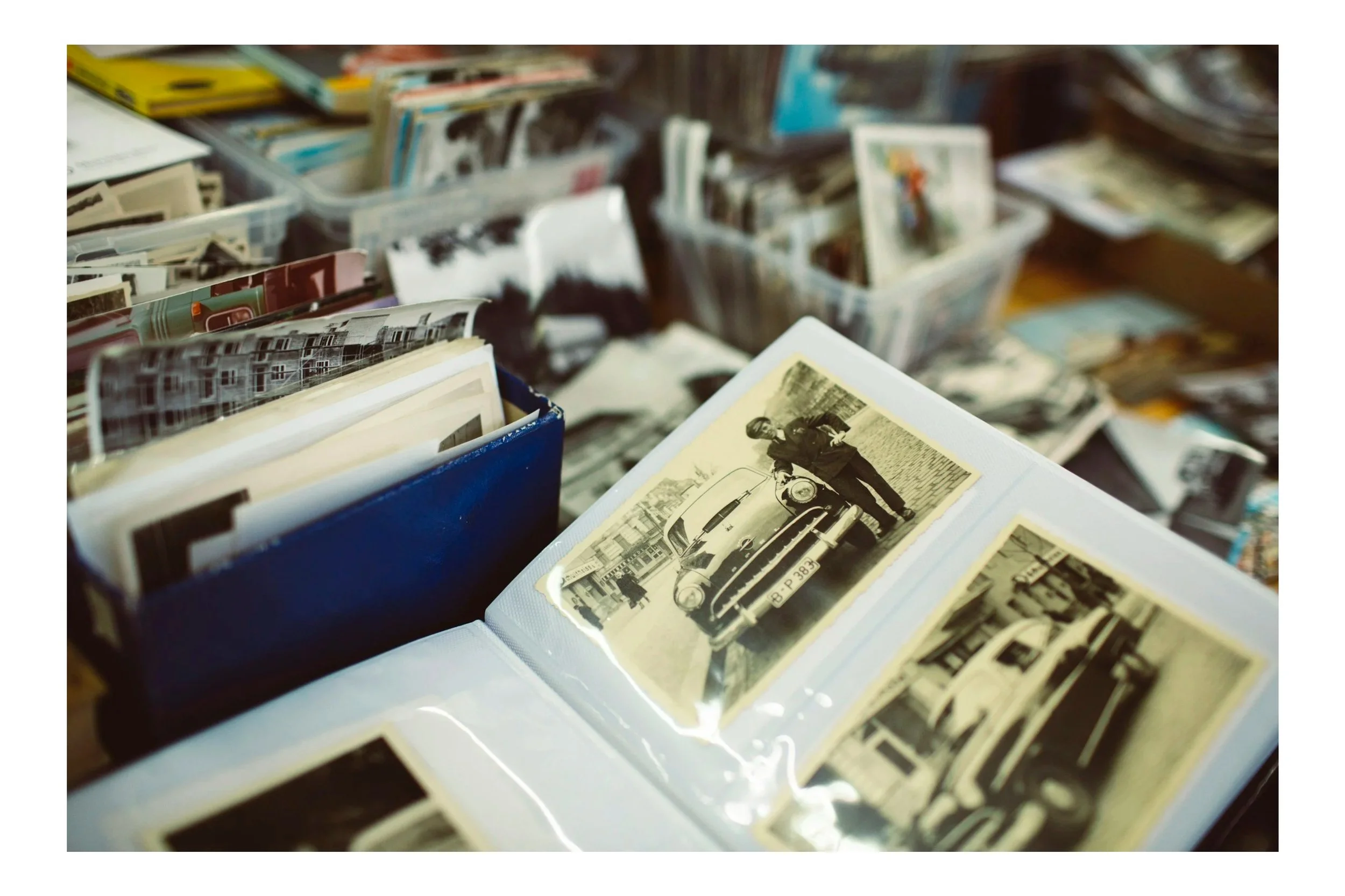 Photo albums and boxes of disorganized photos