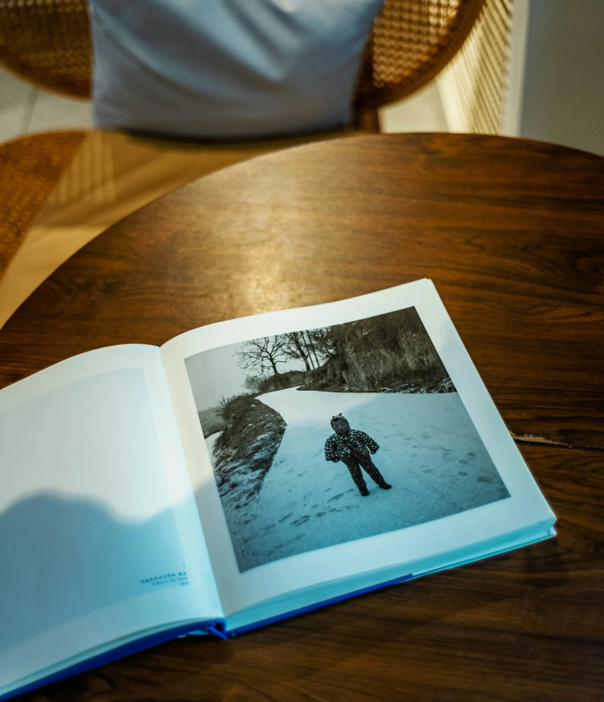 A photobook on table showing how memories and stories can be shared