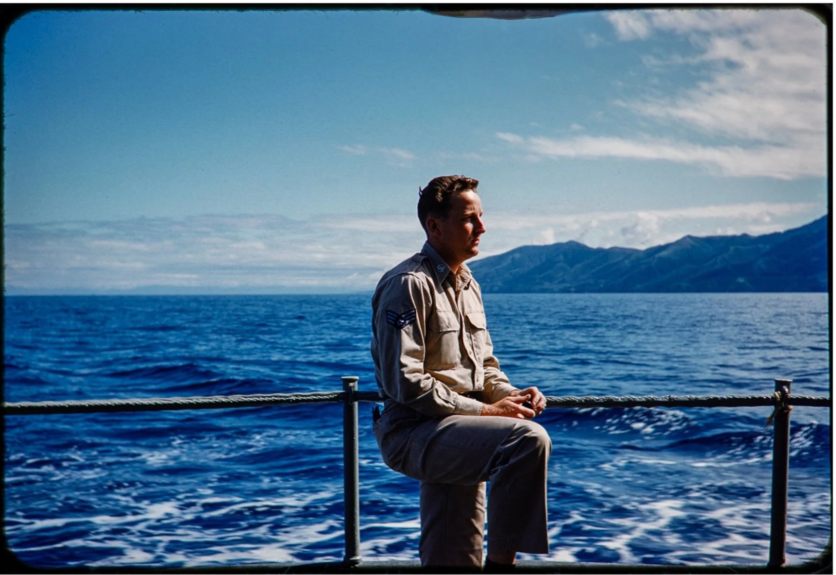 A photo of a man in the air force on a boat on the sea in Japan