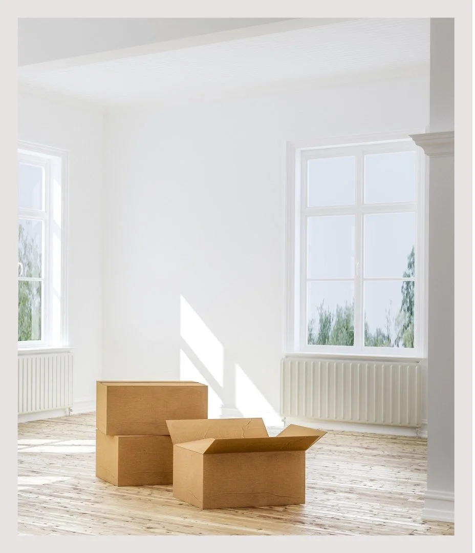Labeled moving boxes in an empty New York City home, ready for relocation