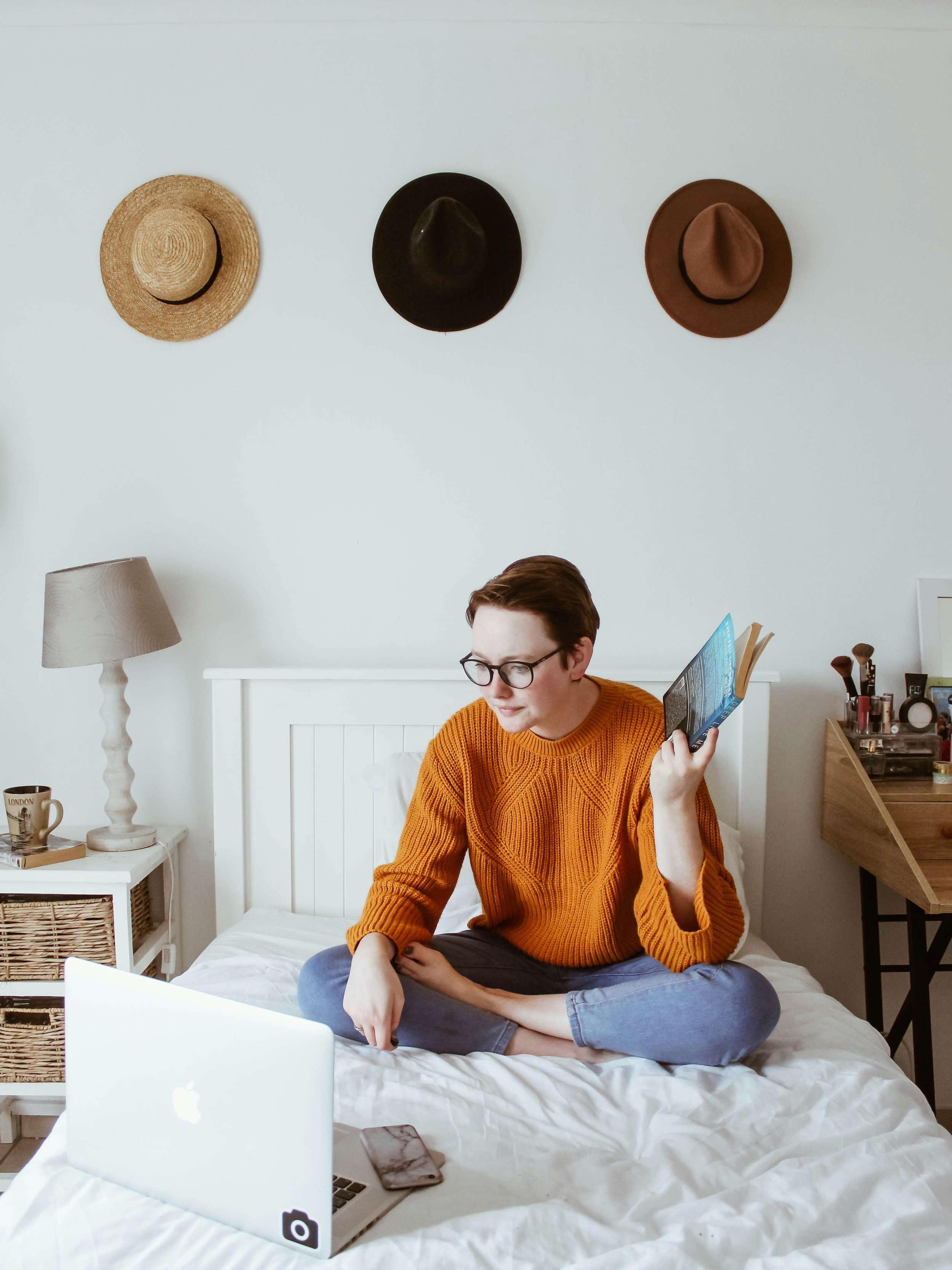 Cozy college dorm room with personal touches, organized storage, and a welcoming space for a first-year student.