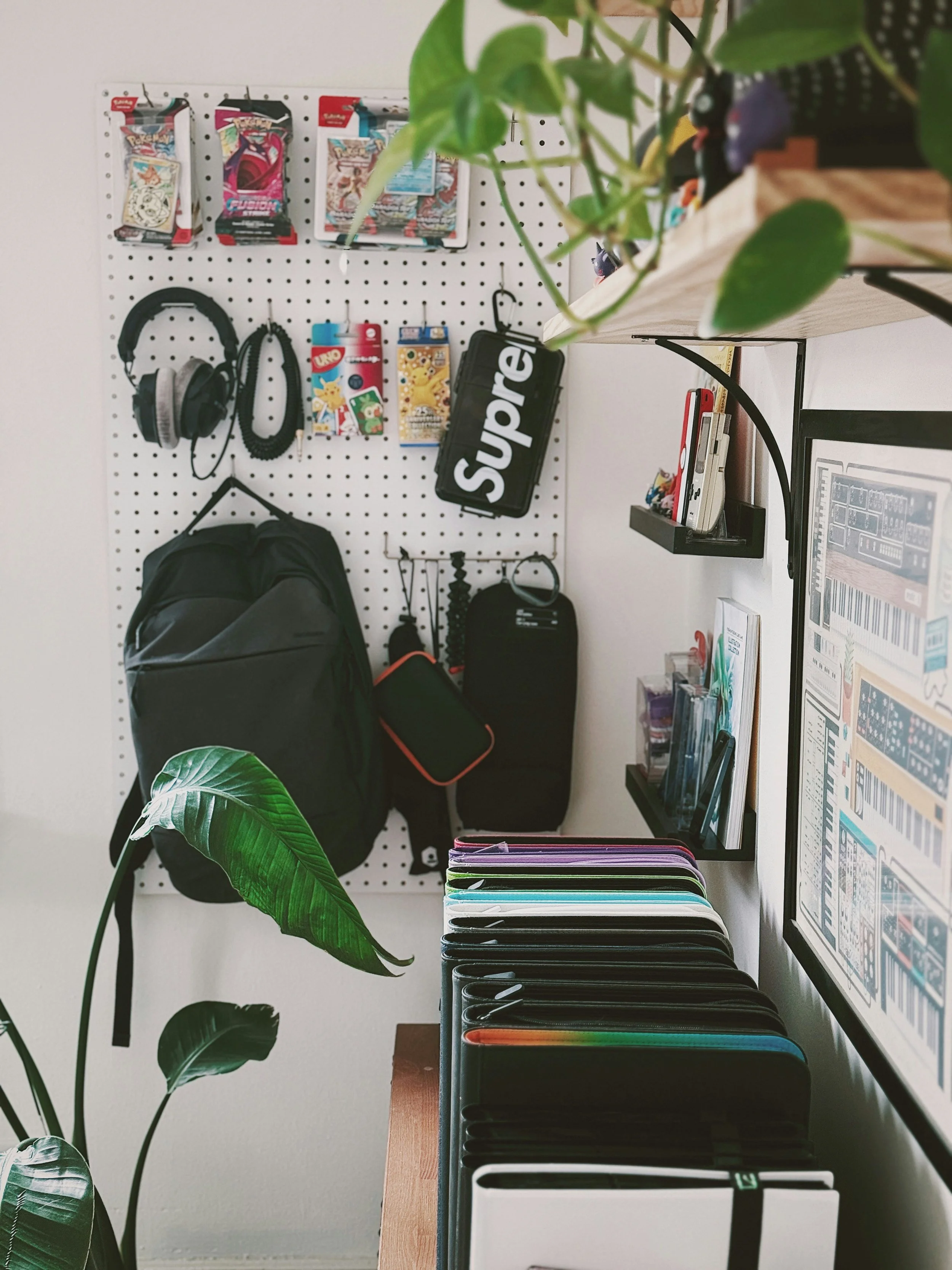 Small college dorm room featuring vertical storage solutions, shelving, and organized essentials.