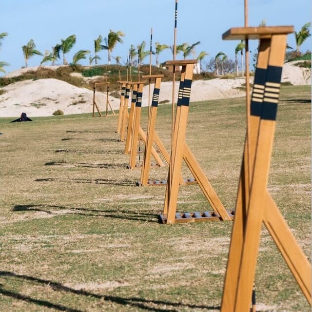 Women practicing Golf with Alignment Sticks