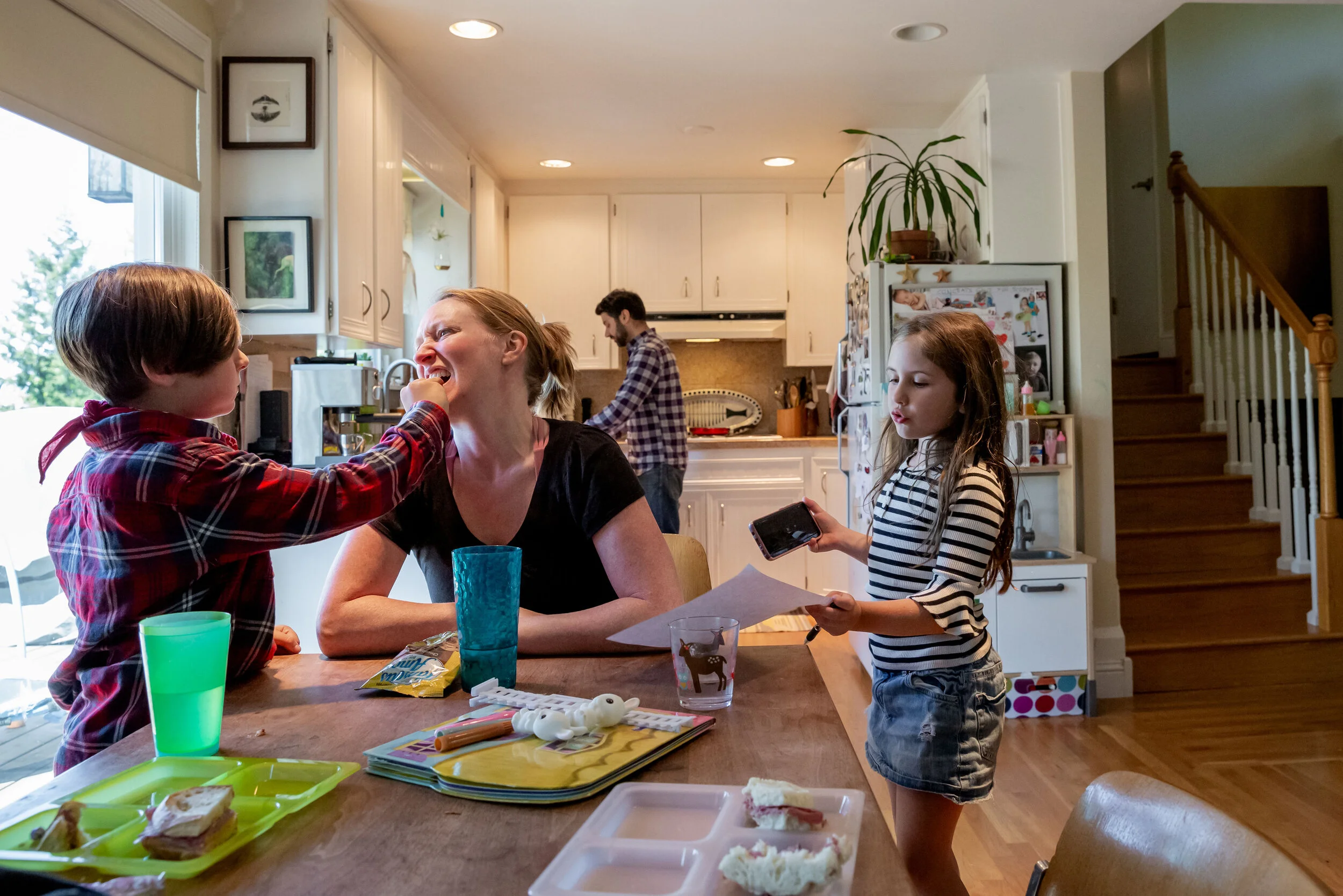 documentary family photographer Kristi Tamcsin plays with her kids.jpg