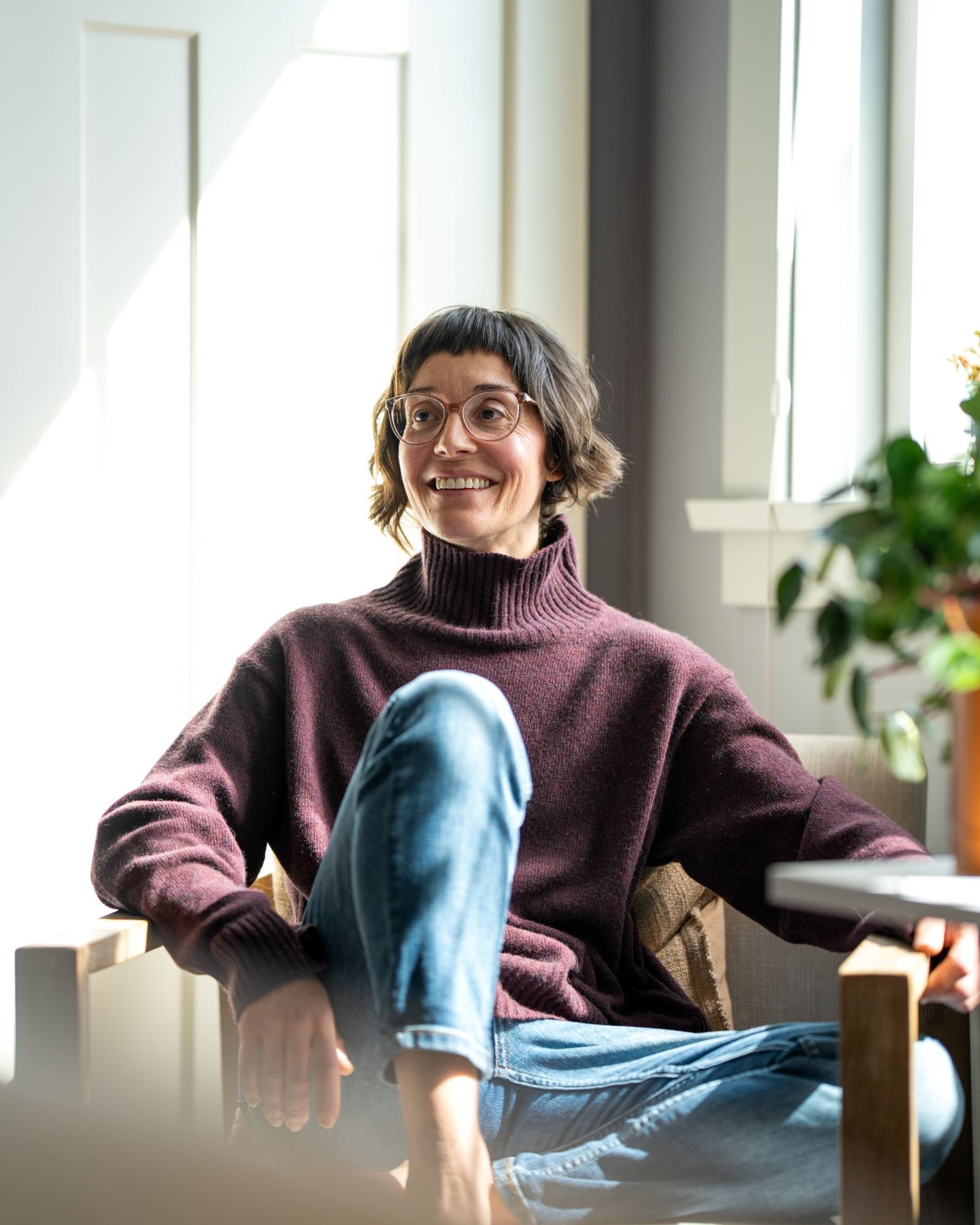 Candid image of Energy Healer, Leigh Blackburn, sitting casually, smiling.