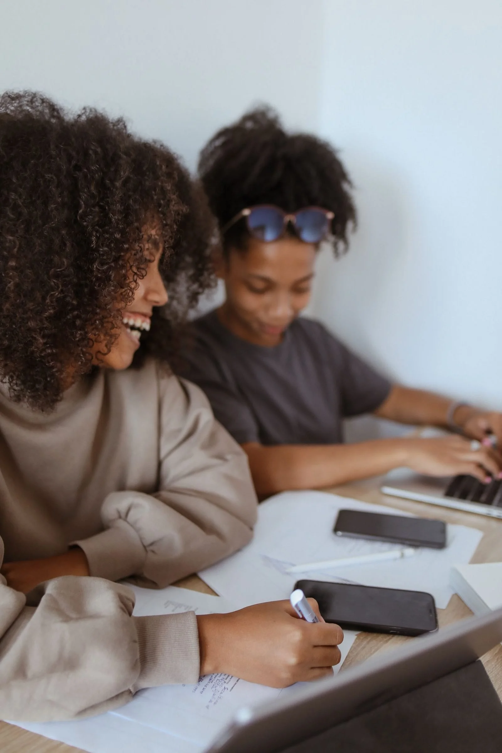 Two students working together at a desk