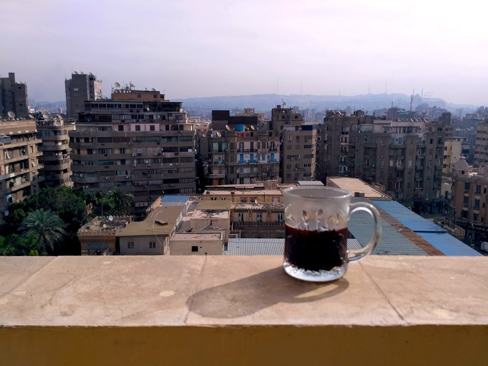  Morning coffee on our balcony in downtown Cairo - a great way to start the day, especially if it's one of the days when the police don't come a knockin’ 