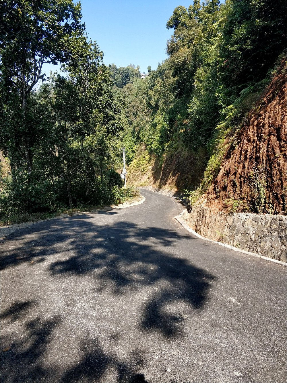  The day's first surprise was that there's somehow a (relatively) newly paved road once you get beyond where almost all the cars are. 