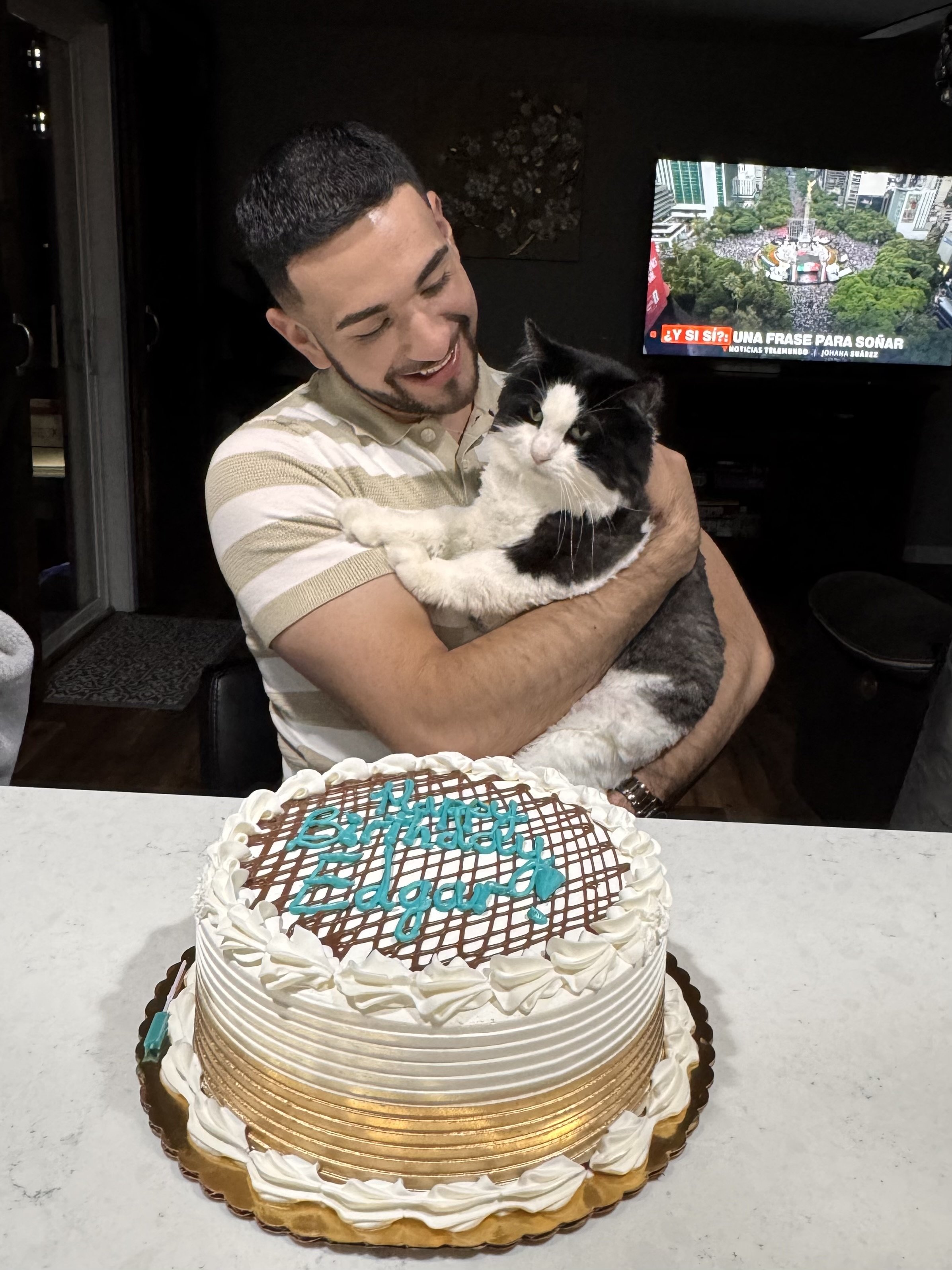 Edgar Quiroz Sanchez holding a cat