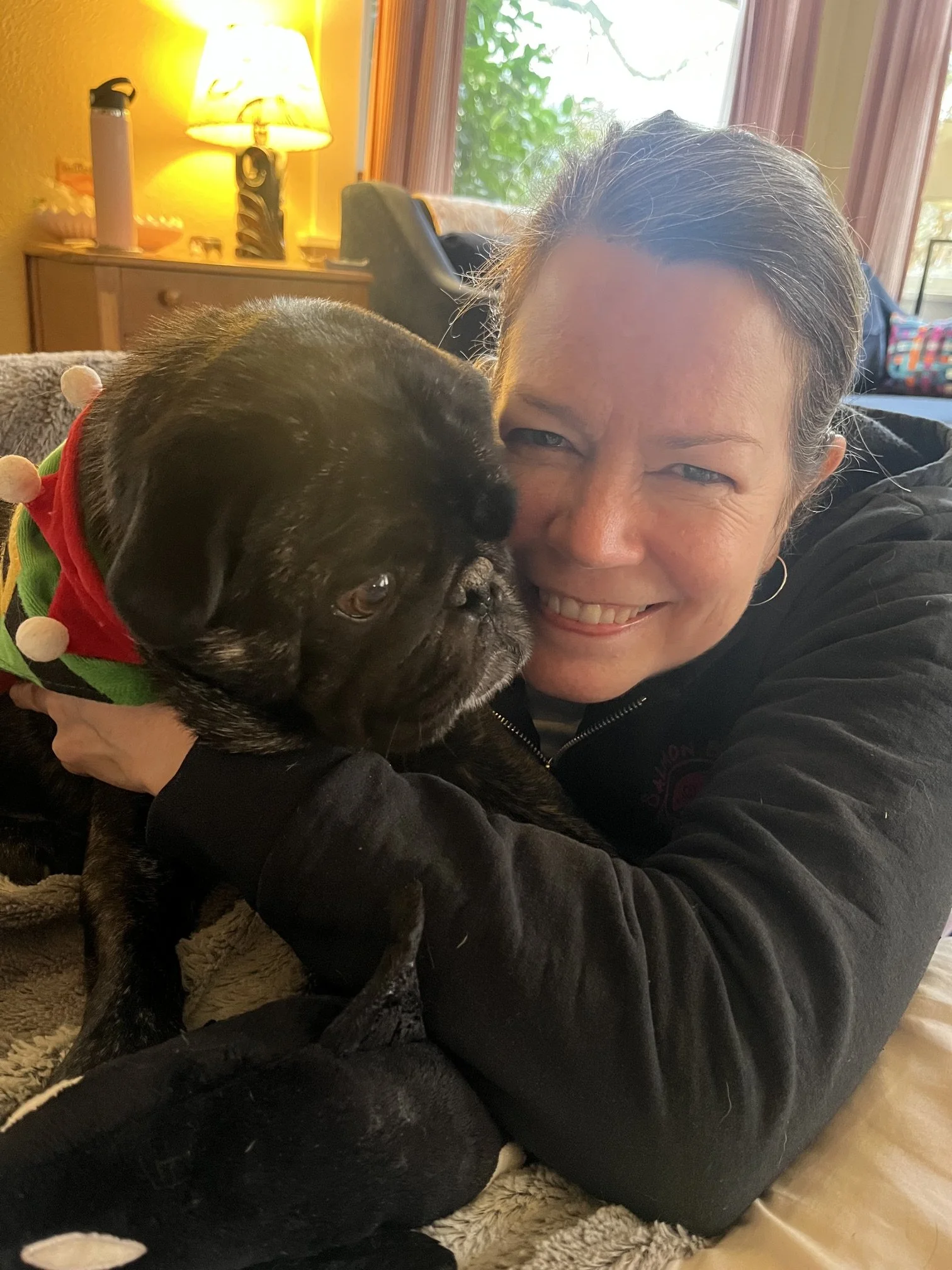 Aleen Adams of Sequoia Teen Counseling Center holding her dog