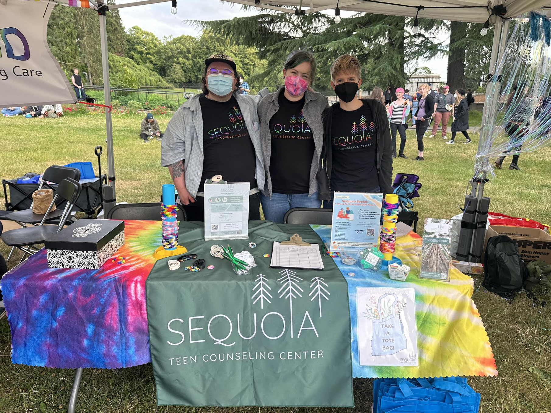 Alaina Boyle, Amanda Watson, and Hunter Baril at Sequoia Teen Counseling Center's table for Trans Pride 2026