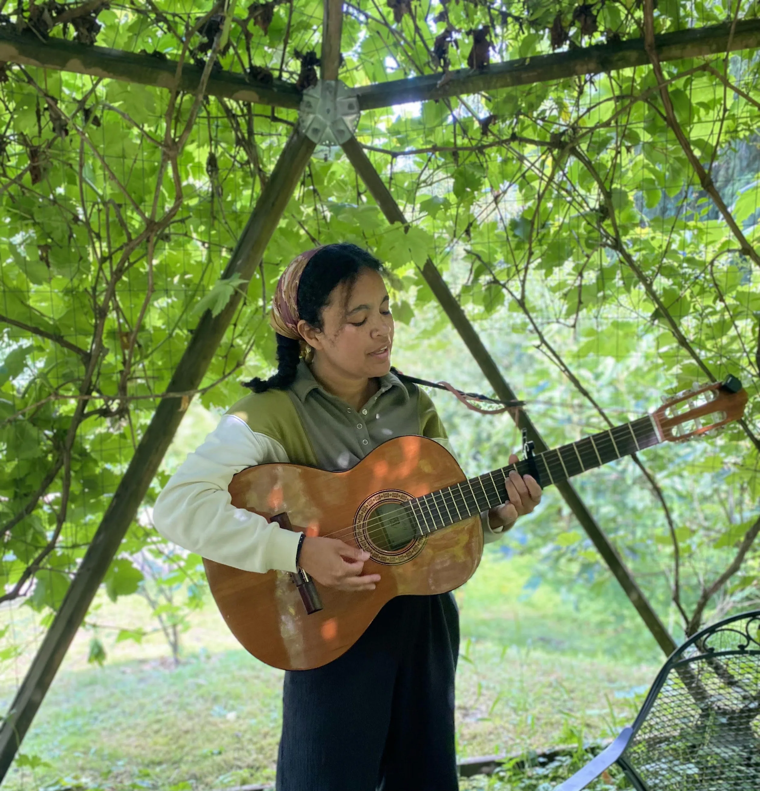 Therapist Ella Simon of Sequoia playing guitar
