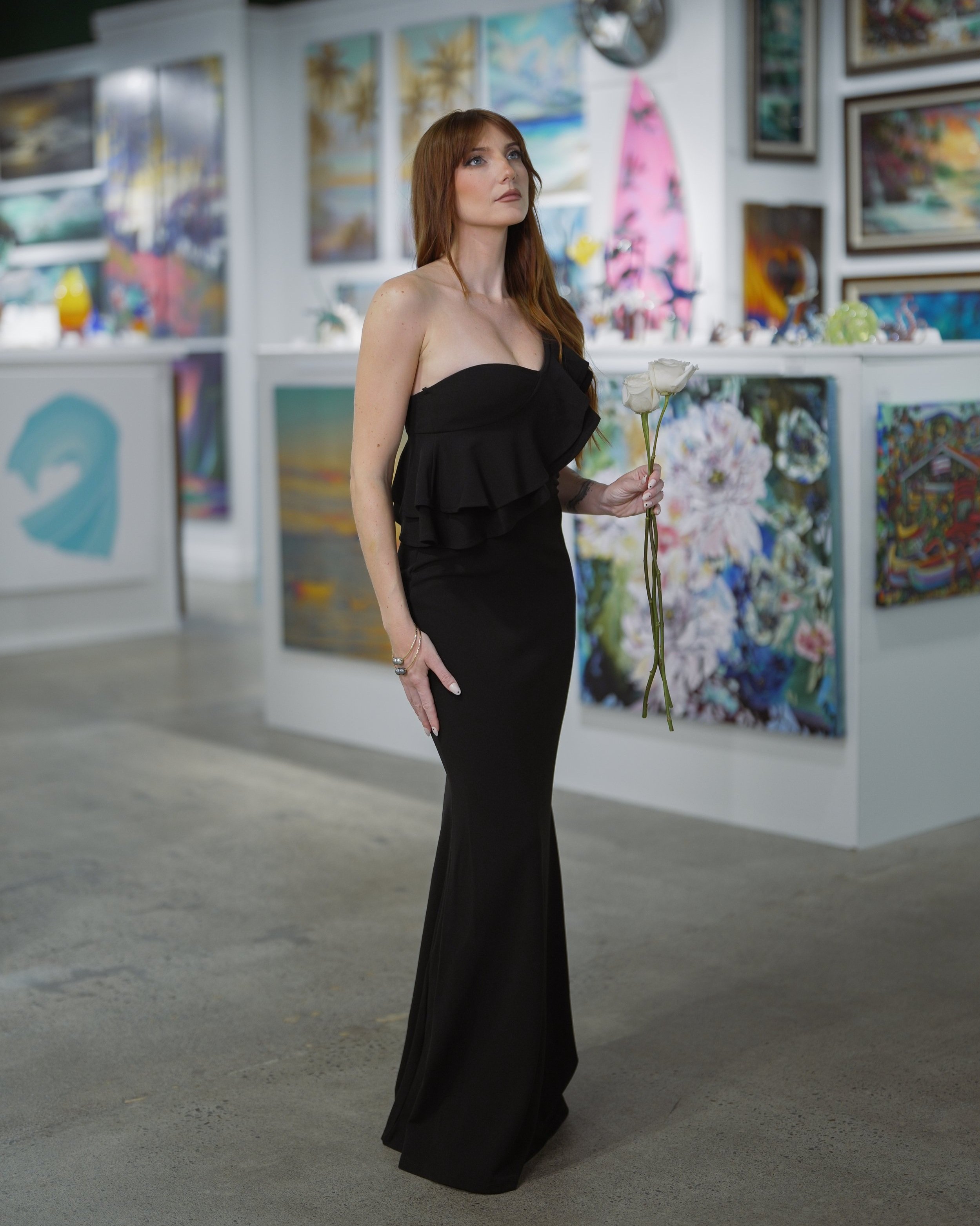 Black asymmetrical one shoulder ruffle dress.