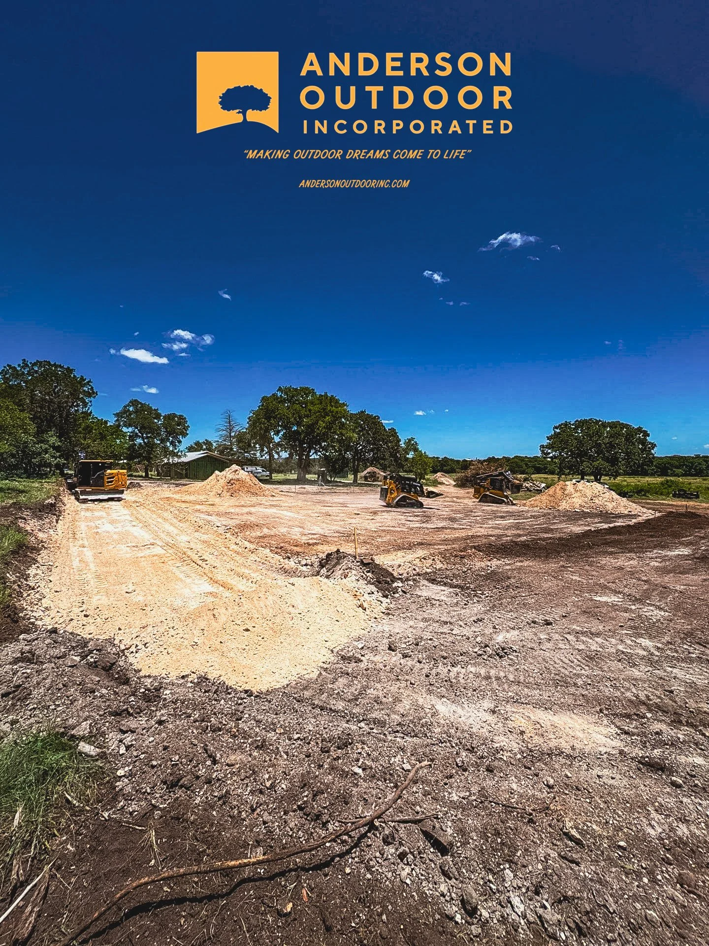 Construction site with dirt and machinery, blue sky with clouds, trees in background, and company logo and slogan of Anderson Outdoor Incorporated at the top.