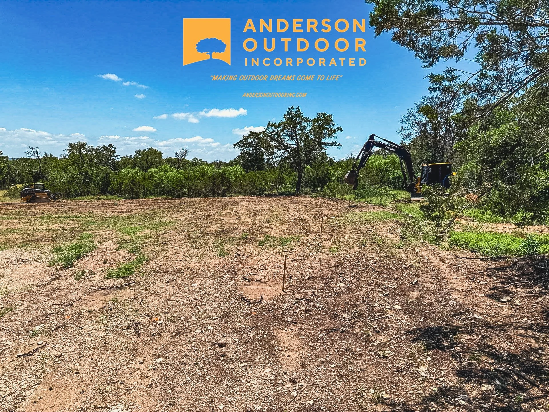 A construction site with an excavator and a utility terrain vehicle (UTV) on cleared land, with trees and a partly cloudy sky in the background, featuring the logo and name of Anderson Outdoor Incorporated at the top.