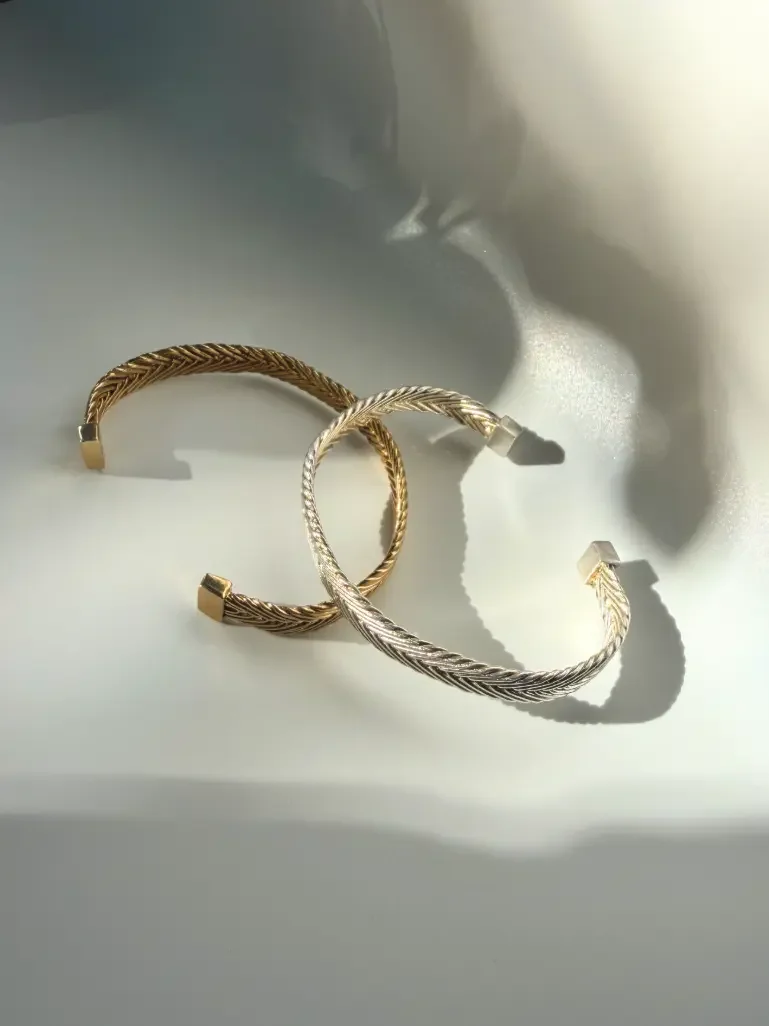 Textured woven bracelet cuffs in gold vermeil and sterling silver made by Kefi in NYC