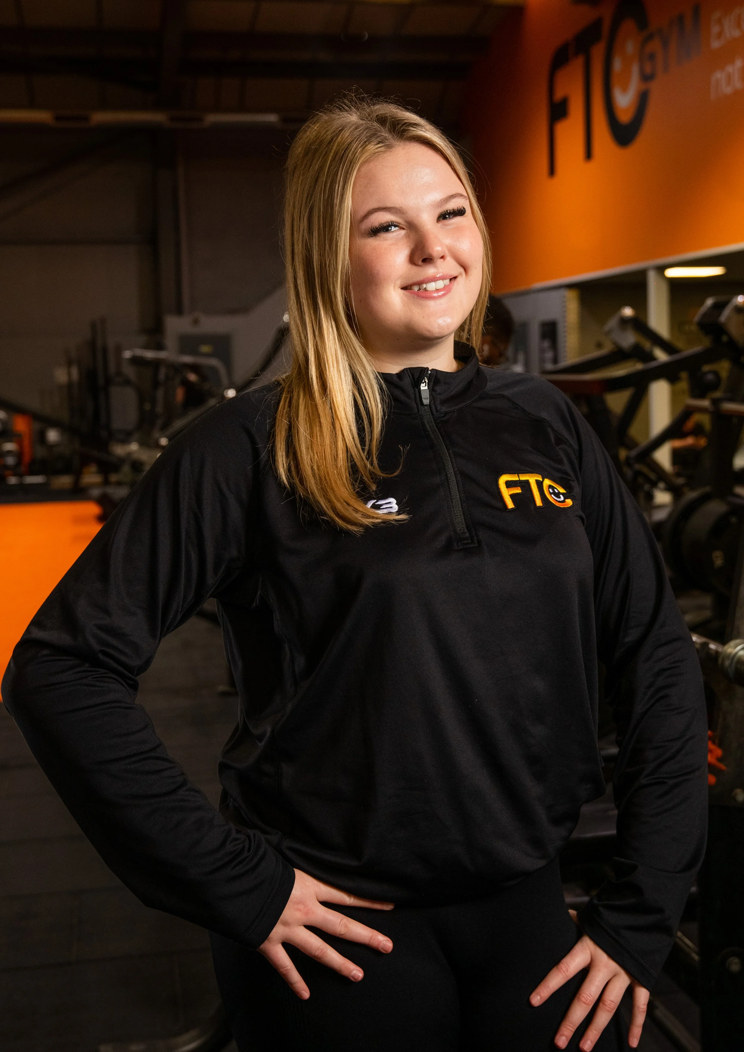 gym staff portrait with gym in background