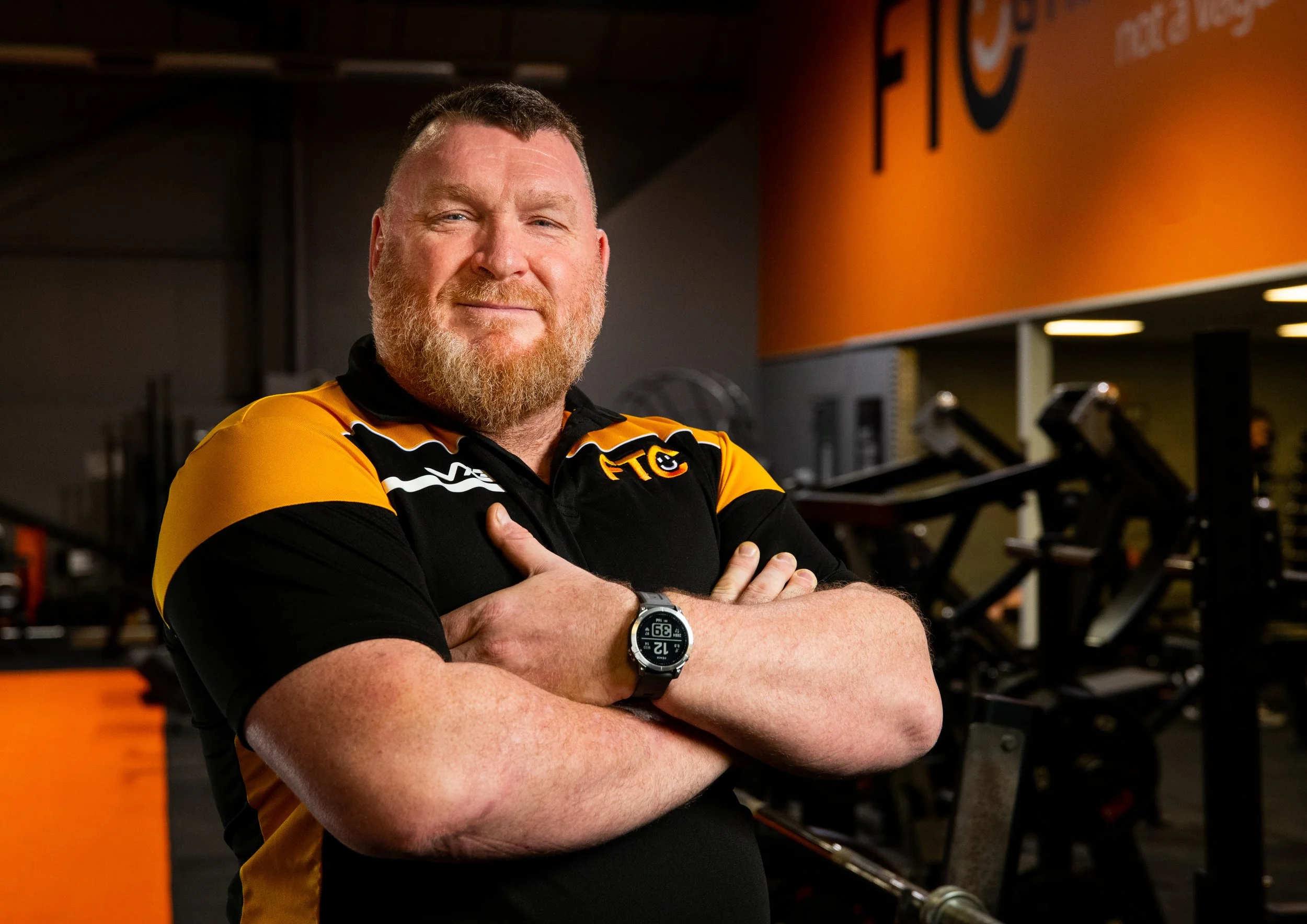 gym staff portrait  with gym in background