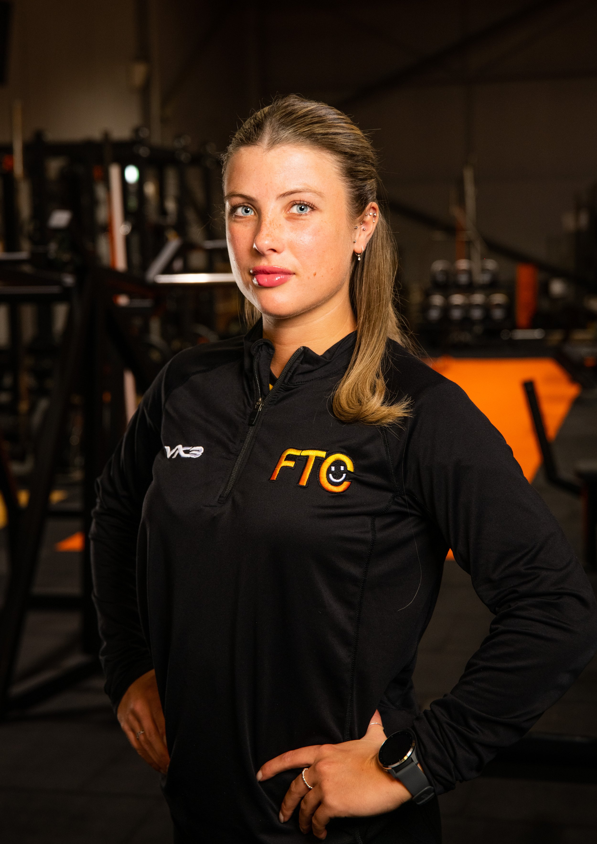 gym staff portrait with gym in background