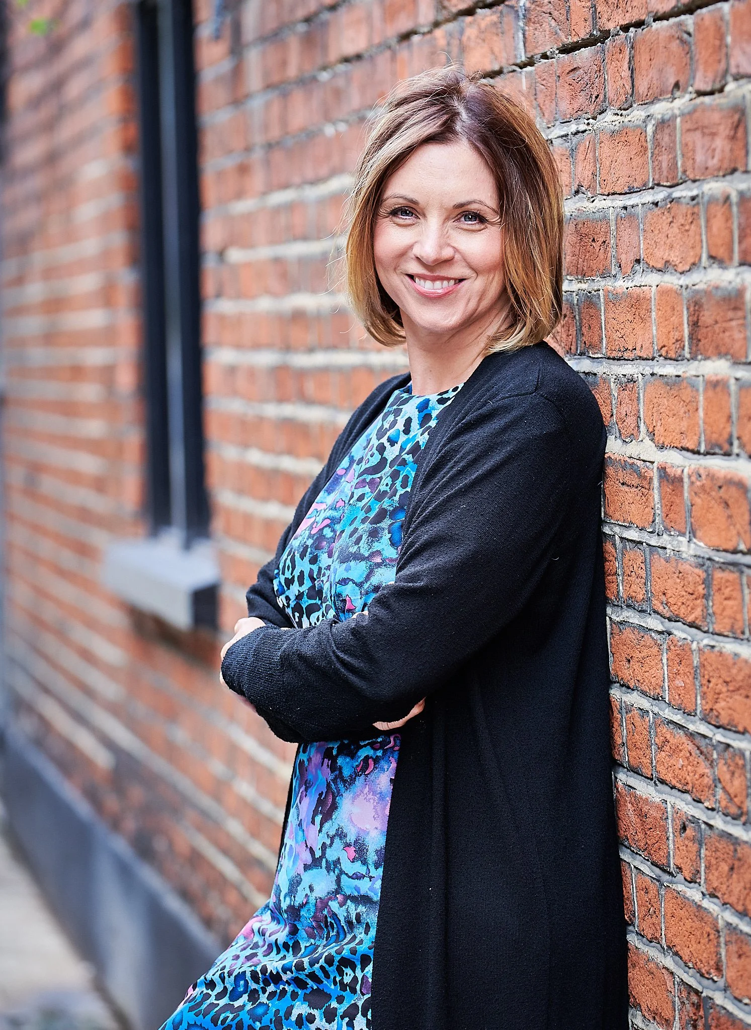 personal brand shoot standing against wall