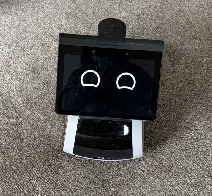 a small mobile robot with smiling eyes
