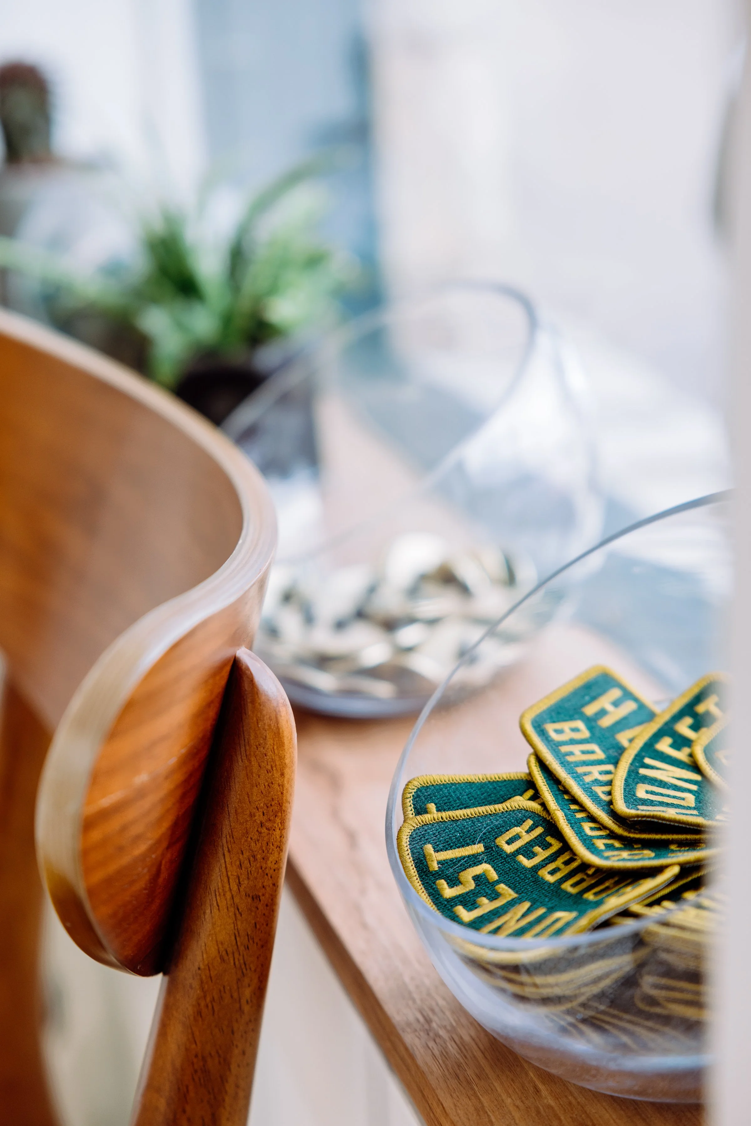 Barbershop detail shot featuring Honest Barber branded merchandise and interior decor in Austin TX.
