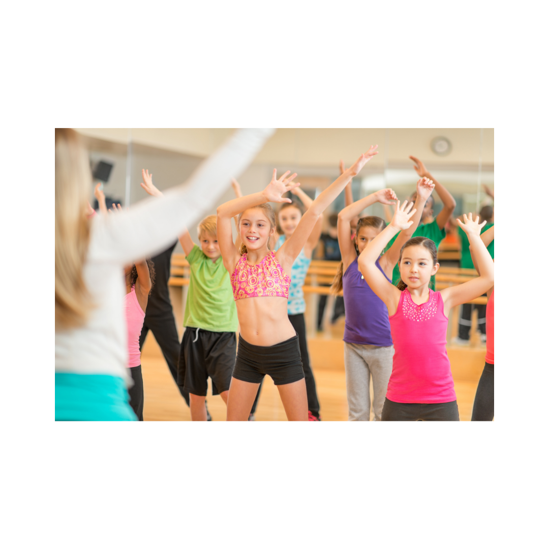 Children participating in a dance or exercise class in a gym or dance studio.