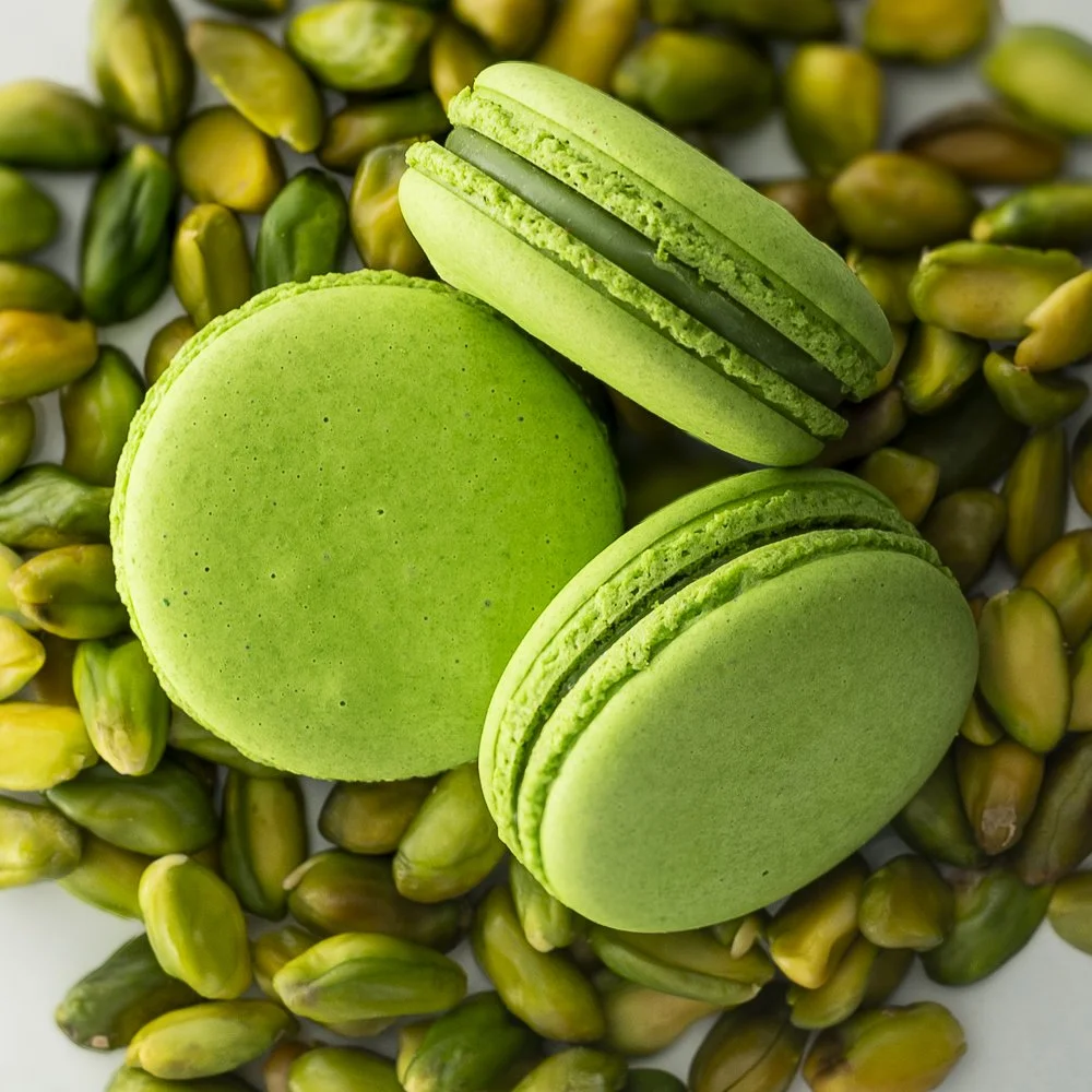 Pistachio French macaron made with almond shells and rich pistachio filling.