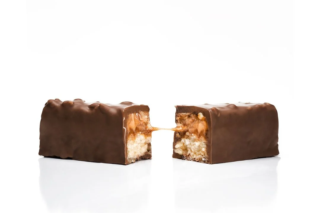 Jean-Marie Auboine's Signature candy bar with crunchy praline, smooth caramel and crispy rice with marshmallow in premium milk chocolate.