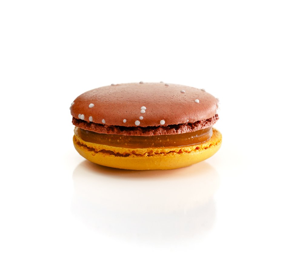 Mandarin Blood Orange French macaron showcasing bright citrus flavors and colorful filling.