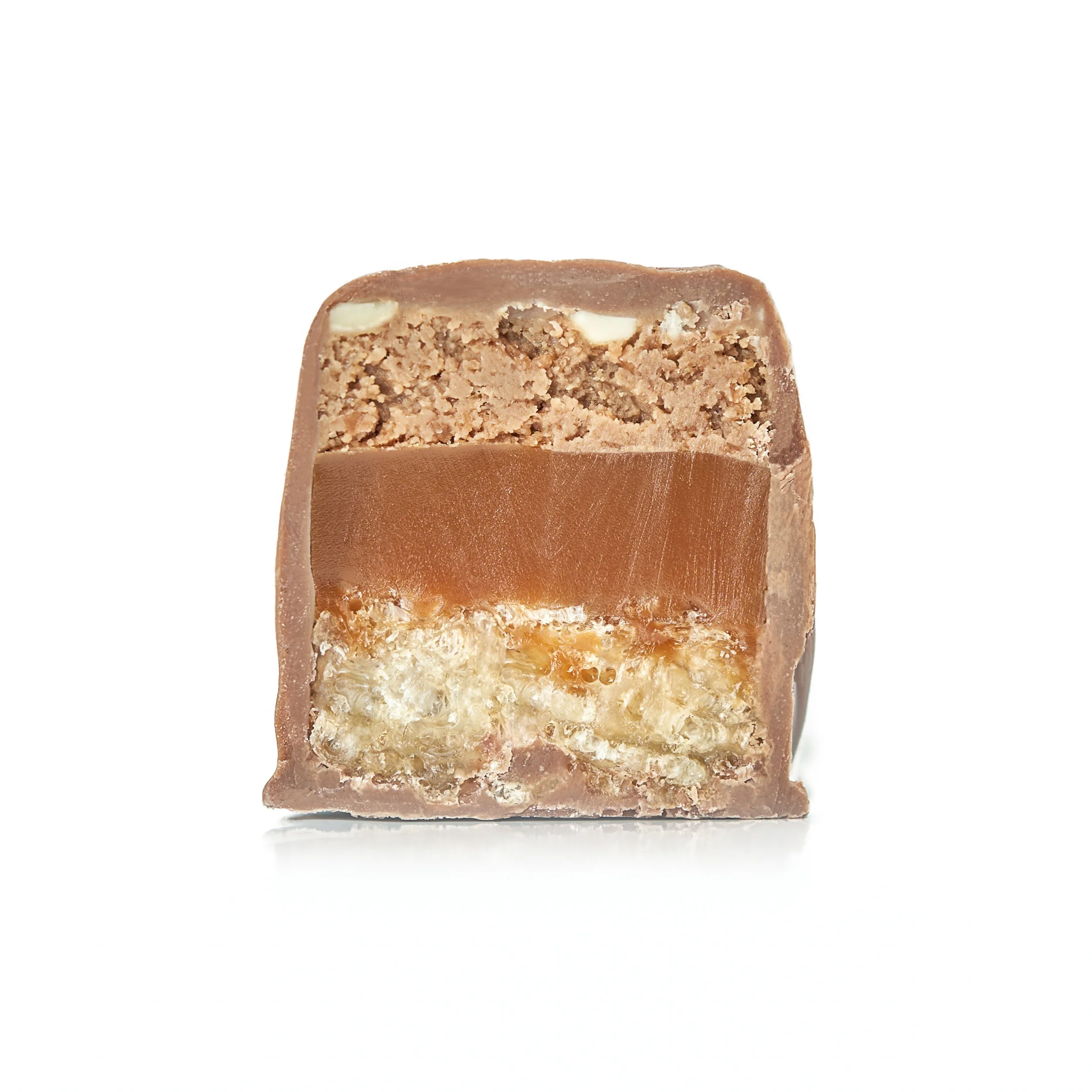 Lion Bar with layers of crispy cereal, hazelnut praline, sea salt caramel ganache, and milk chocolate.
