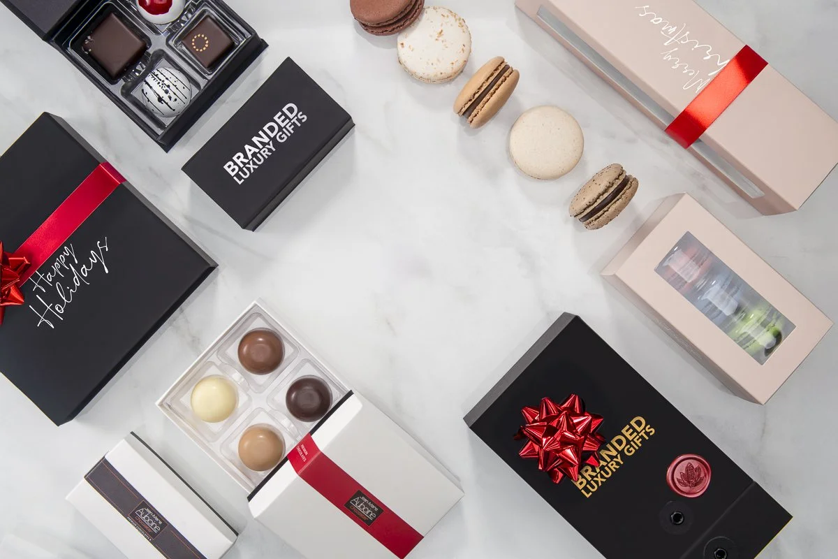 Custom corporate holiday gift boxes with logo options and Christmas bow for branded client gifting