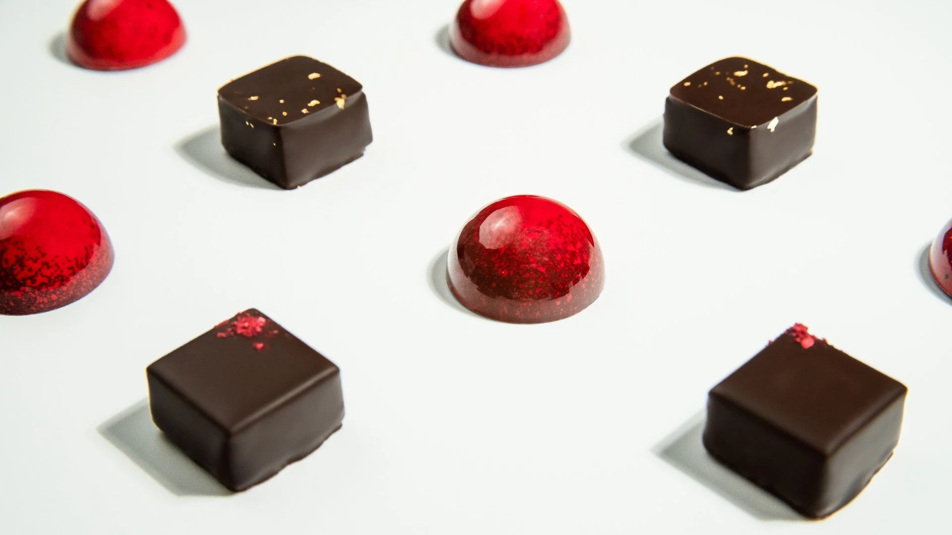 High-end chocolate bonbons with refined airbrushed finishes
