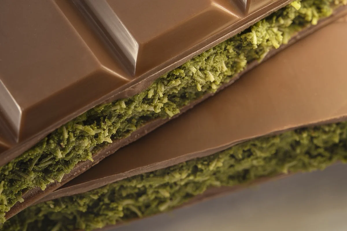Close-up of the Dubai Bar highlighting the pistachio and kadayif texture inside smooth milk chocolate.
