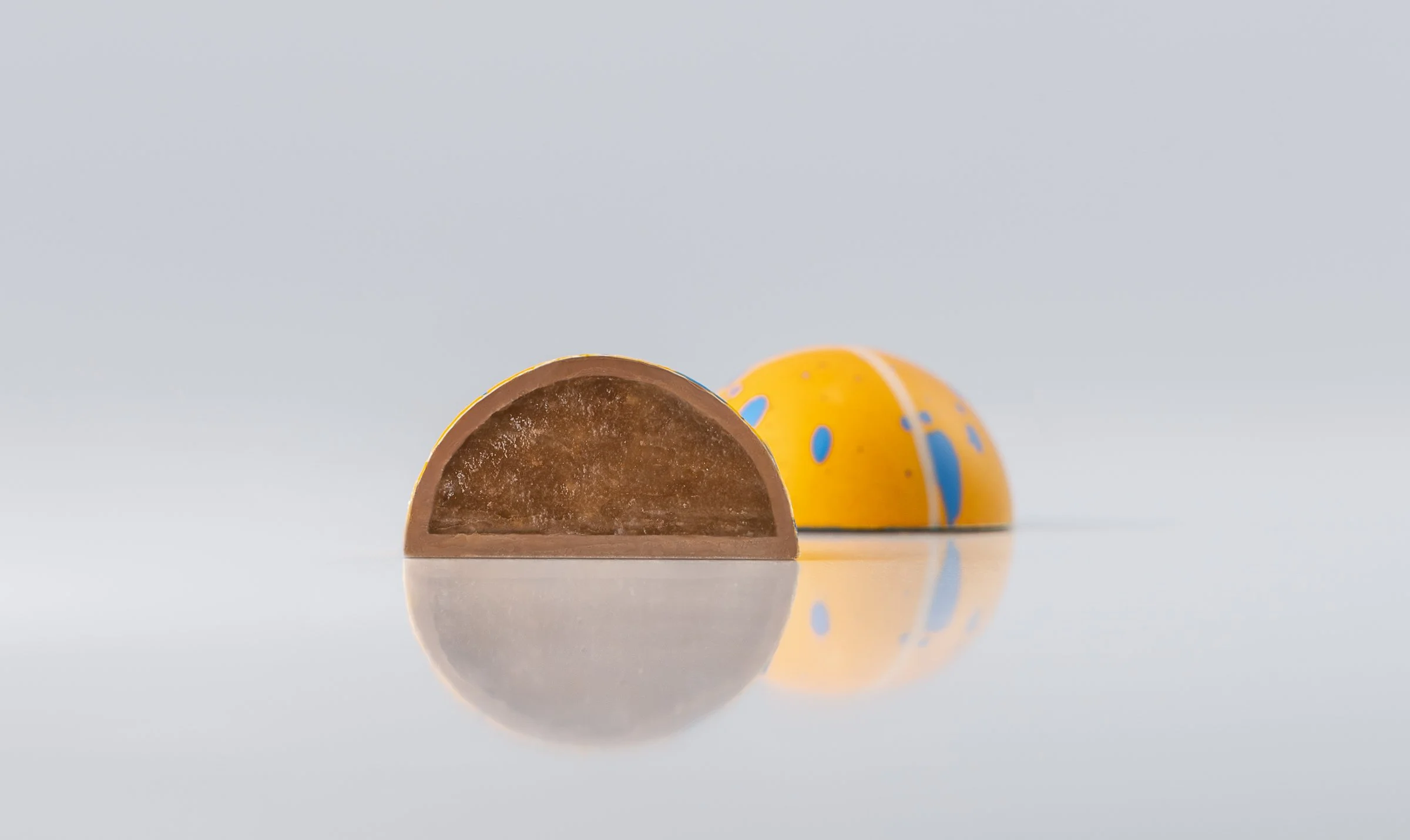 Passion Fruit Ganache in milk ganache as a perfect pairing for a bright flavor handcrafted by Jean-Marie Auboine Chocolatier