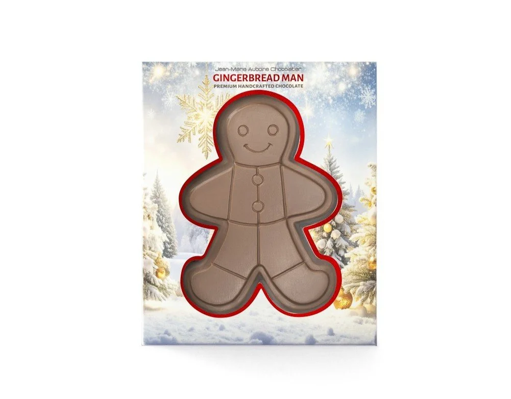 Premium milk chocolate and peanut praline Gingerbread Man figurine in festive holiday packaging