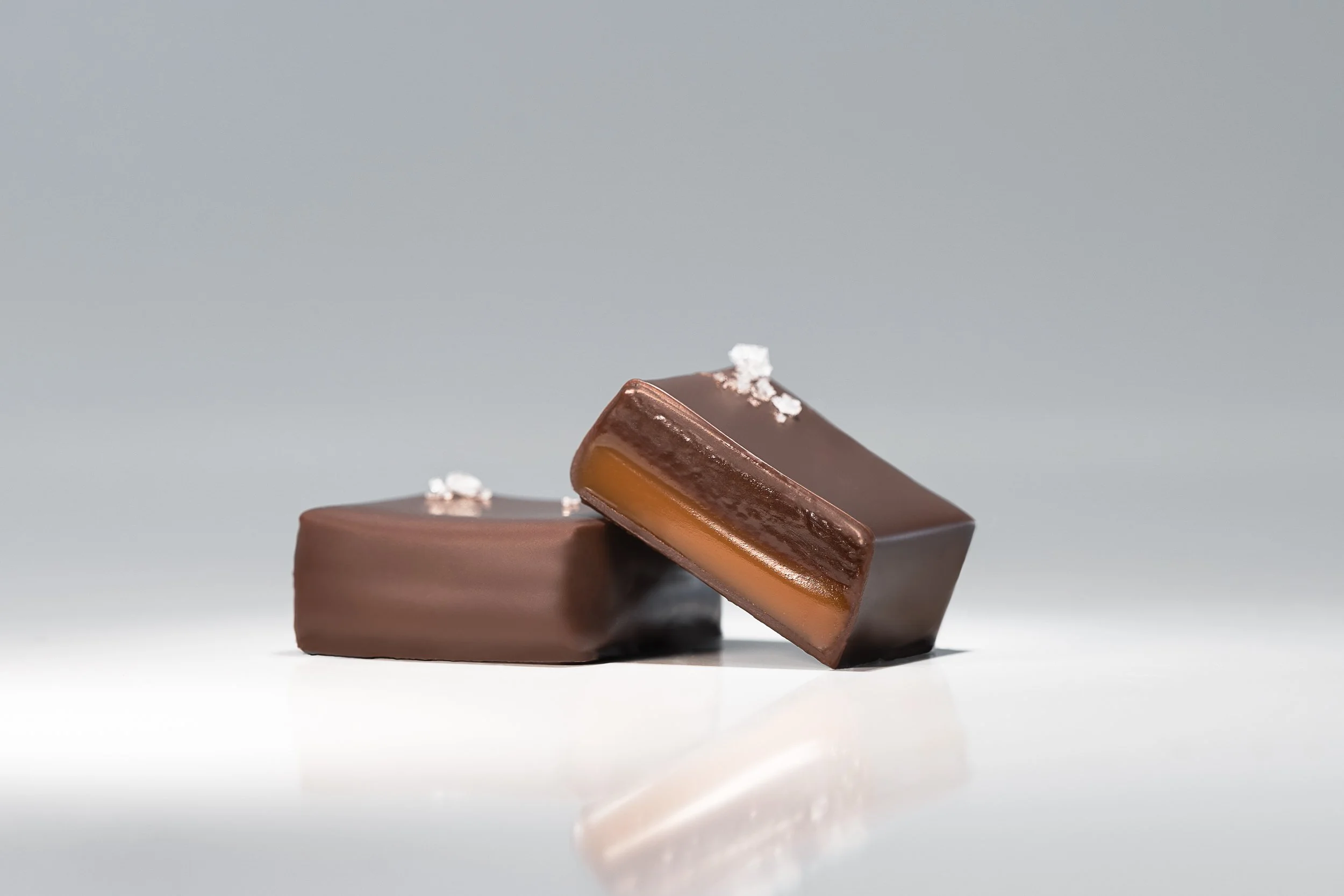 Award-winning Double Sea Salt Caramels enrobed in dark chocolate and finished with French Guérande fleur de sel.