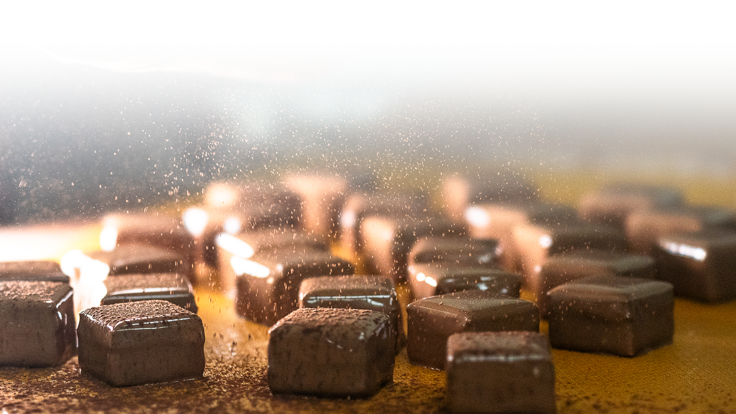 Chocolate Bonbon being enrobed in premium milk chocolate by Jean-Marie Auboine Chocolate
