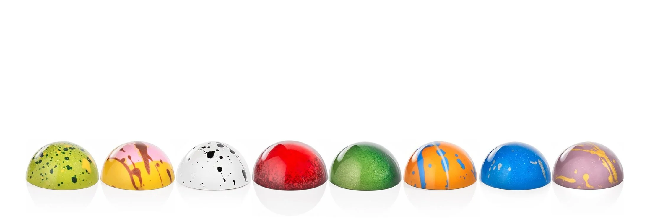 Assortement of premium chocolate bonbons hand-painted with ganache and praline fillings