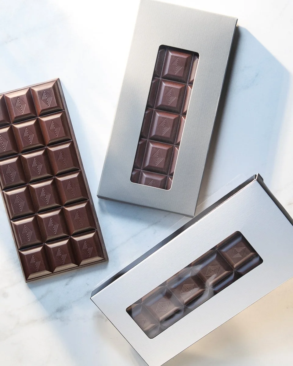 assortment of premium dark chocolate bars by jean-marie auboine chocolatier